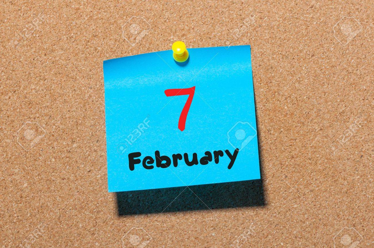 February 7th Day 7 of month calendar on cork notice board background